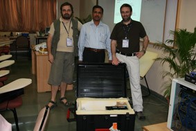 ARPL's Carlo Fonda and Marco Zennaro donating an early sample of the wireless training kit to Prof. Bharat Chaudhari of the Indian Institute of Information Technology in Pune, India.  - big
